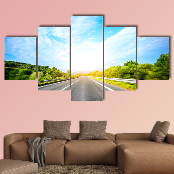 Highway outside the city at sunset multi panel canvas wall art