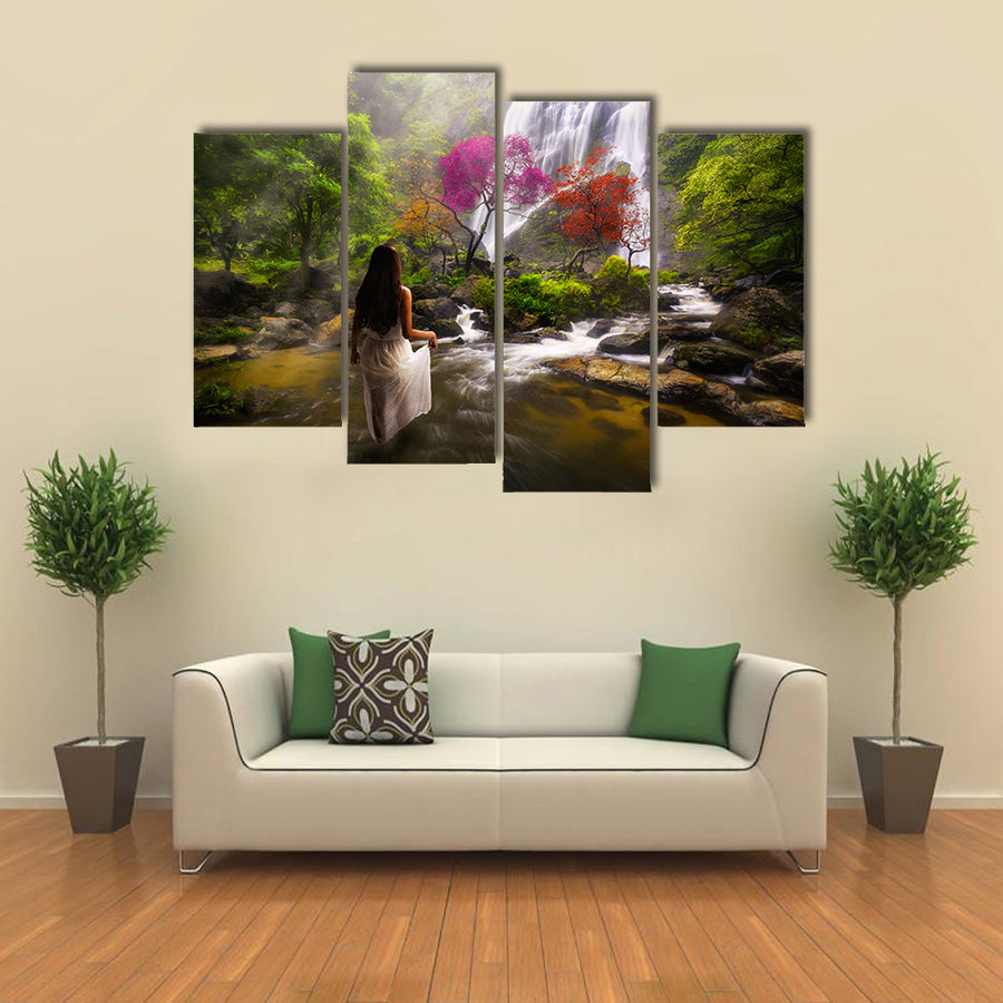 Young asian woman standing by a stream in the dreamy forest multi panel canvas wall art