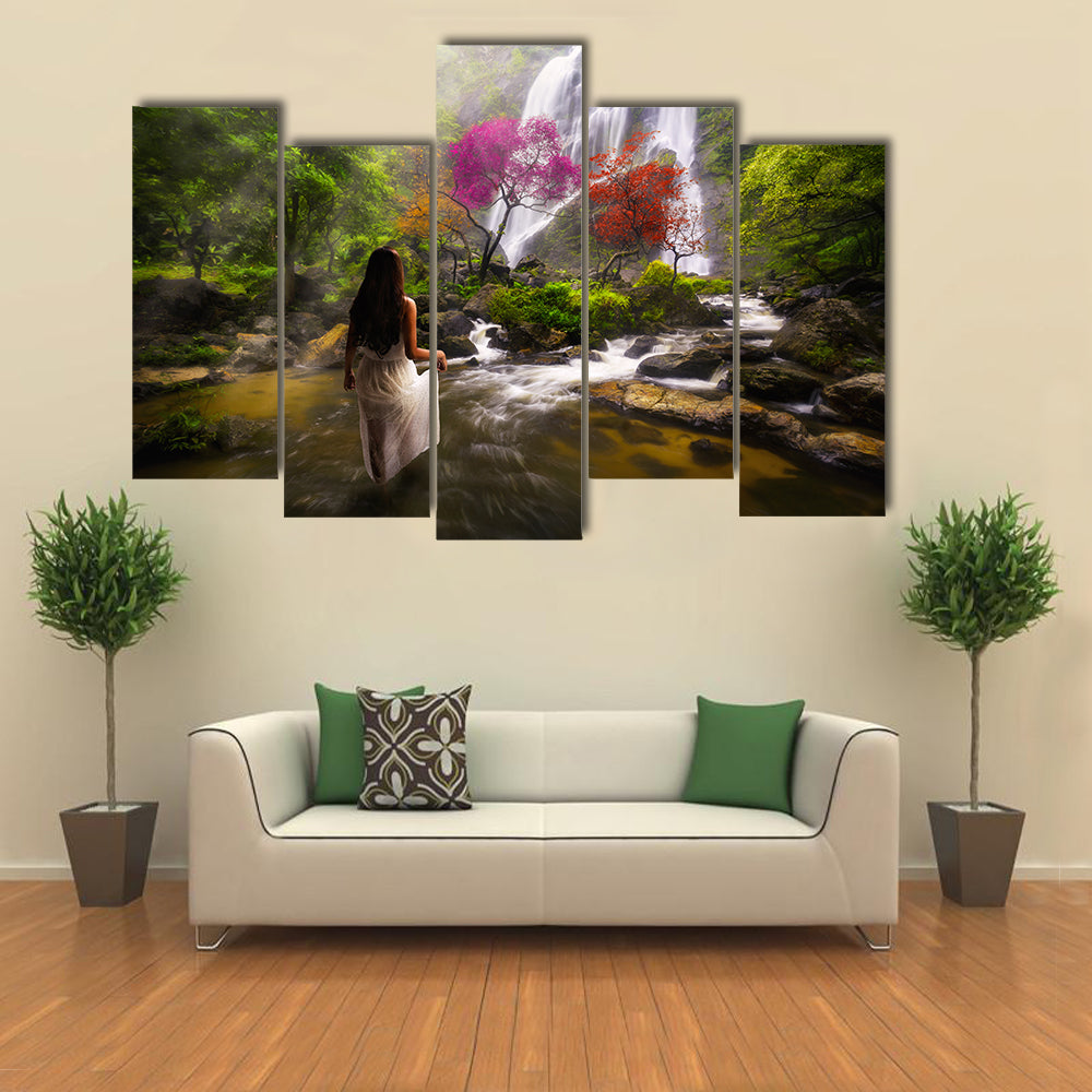 Young asian woman standing by a stream in the dreamy forest multi panel canvas wall art
