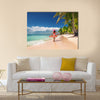 Carefree, Young woman relaxing on the Islands beach Multi Panel Canvas Wall Art