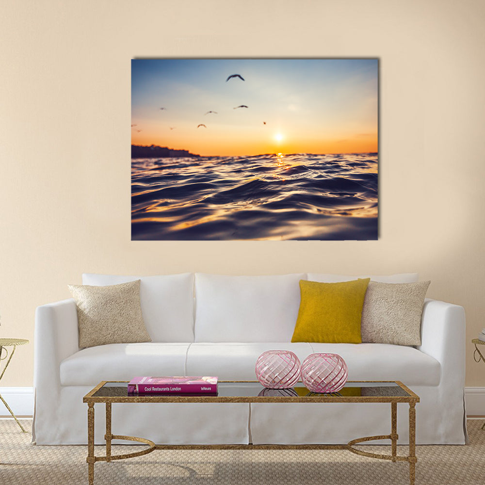 Sunrise light shining on ocean wave Multi Panel Canvas Wall Art