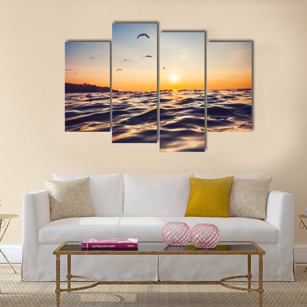 Sunrise light shining on ocean wave Multi Panel Canvas Wall Art