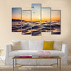 Sunrise light shining on ocean wave Multi Panel Canvas Wall Art