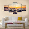 Sunrise light shining on ocean wave Multi Panel Canvas Wall Art