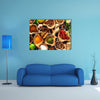 Various herbs and spices on wooden table Multi panel canvas wall art