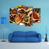 Various herbs and spices on wooden table Multi panel canvas wall art