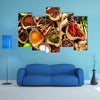 Various herbs and spices on wooden table Multi panel canvas wall art