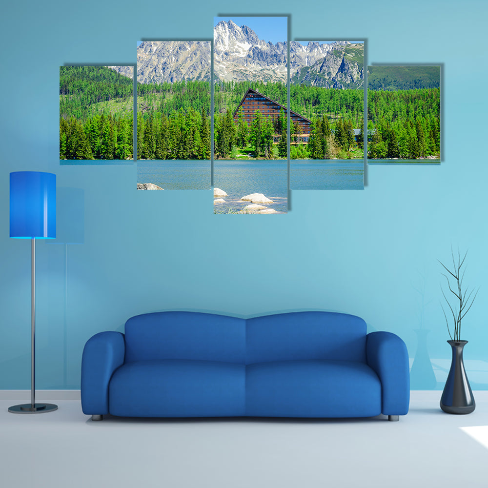Amazing mountain lake with wooden hotel at the bank multi panel canvas wall art