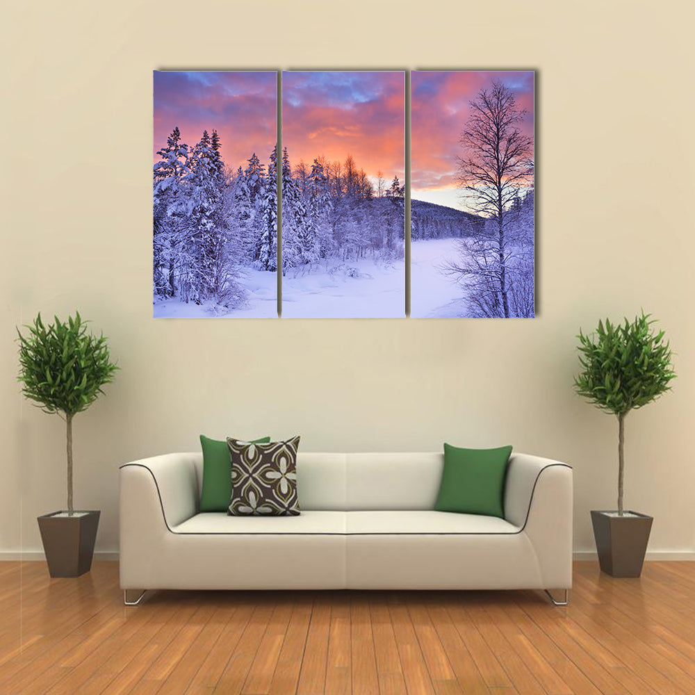 A frozen river in a wintry landscape multi panel canvas wall art