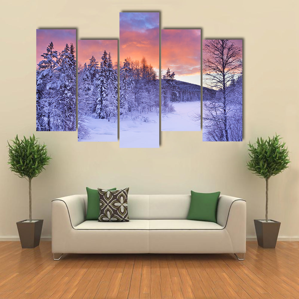 A frozen river in a wintry landscape multi panel canvas wall art