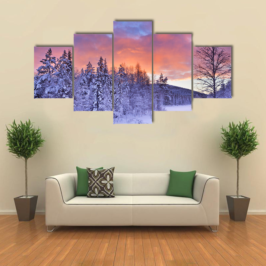 A frozen river in a wintry landscape multi panel canvas wall art