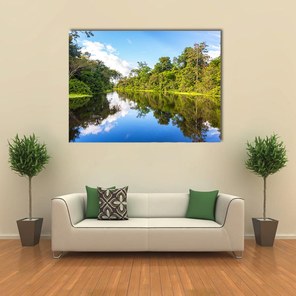 Amazon rain forest perfectly reflected in a small river near Iquitos, Peru multi panel canvas wall art