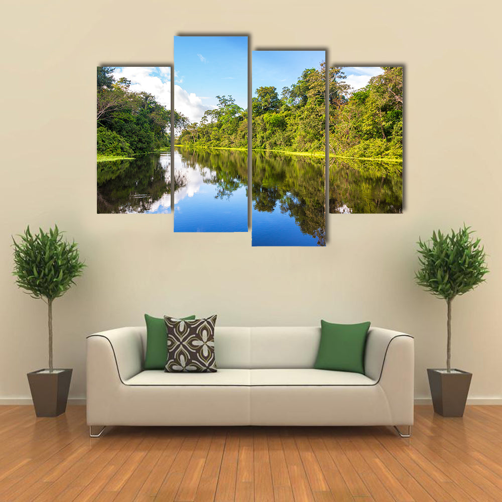 Amazon rain forest perfectly reflected in a small river near Iquitos, Peru multi panel canvas wall art
