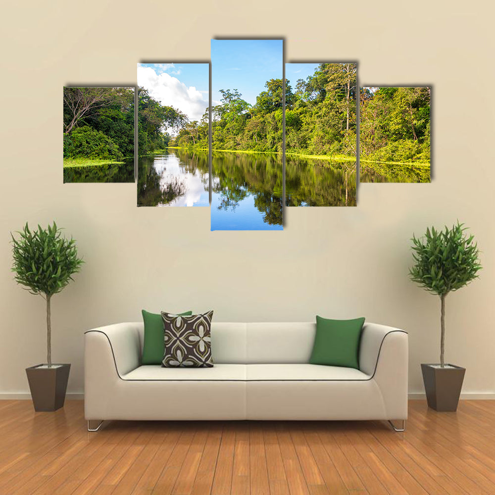 Amazon rain forest perfectly reflected in a small river near Iquitos, Peru multi panel canvas wall art