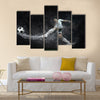 Splash of drops around football player under water Multi panel canvas wall art