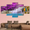 Parrot macaw against tropical waterfall in deep forest multi panel canvas wall art