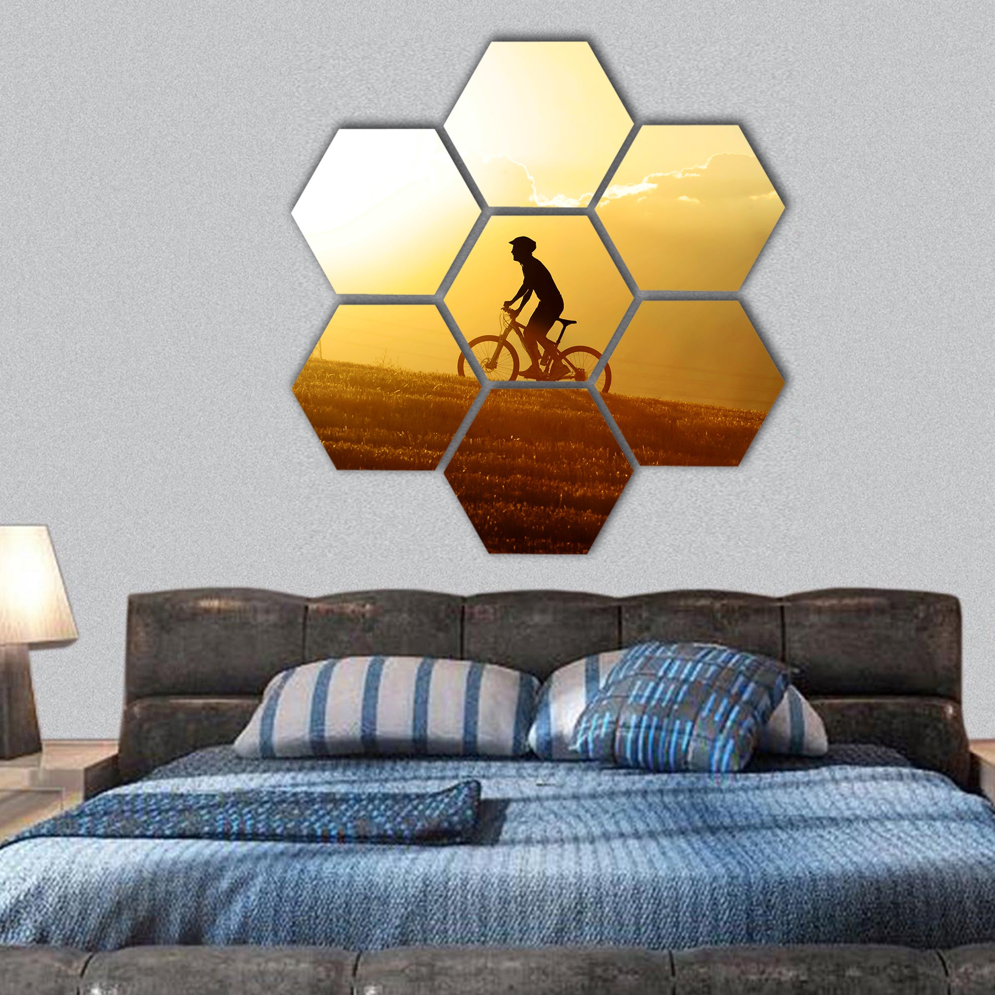 silhouette of sport man cycling uphill riding hexagonal canvas wall art