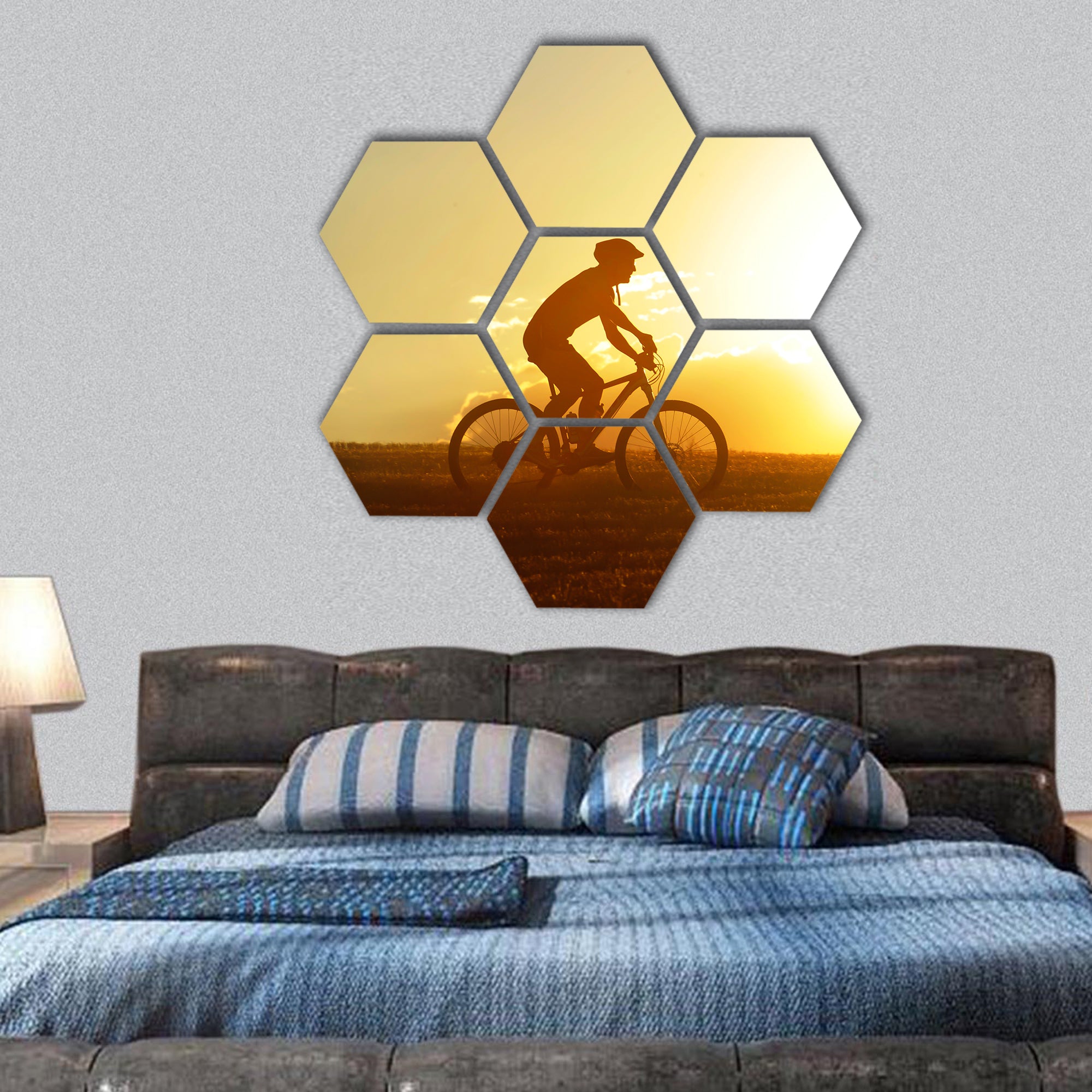 silhouette of sport man cycling uphill riding hexagonal canvas wall art