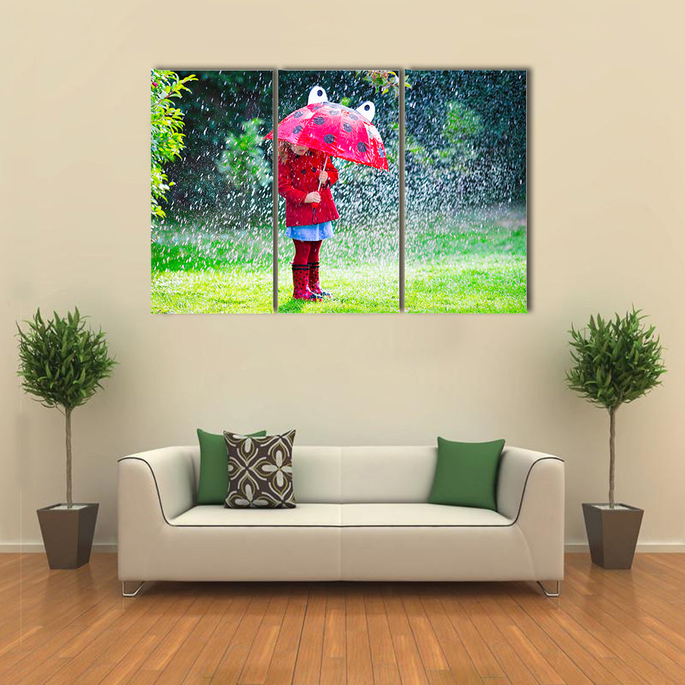 A Little Girl With Red Attire And Umbrella Enjoying The Serenity Of The Rain, Multi Panel Wall Art