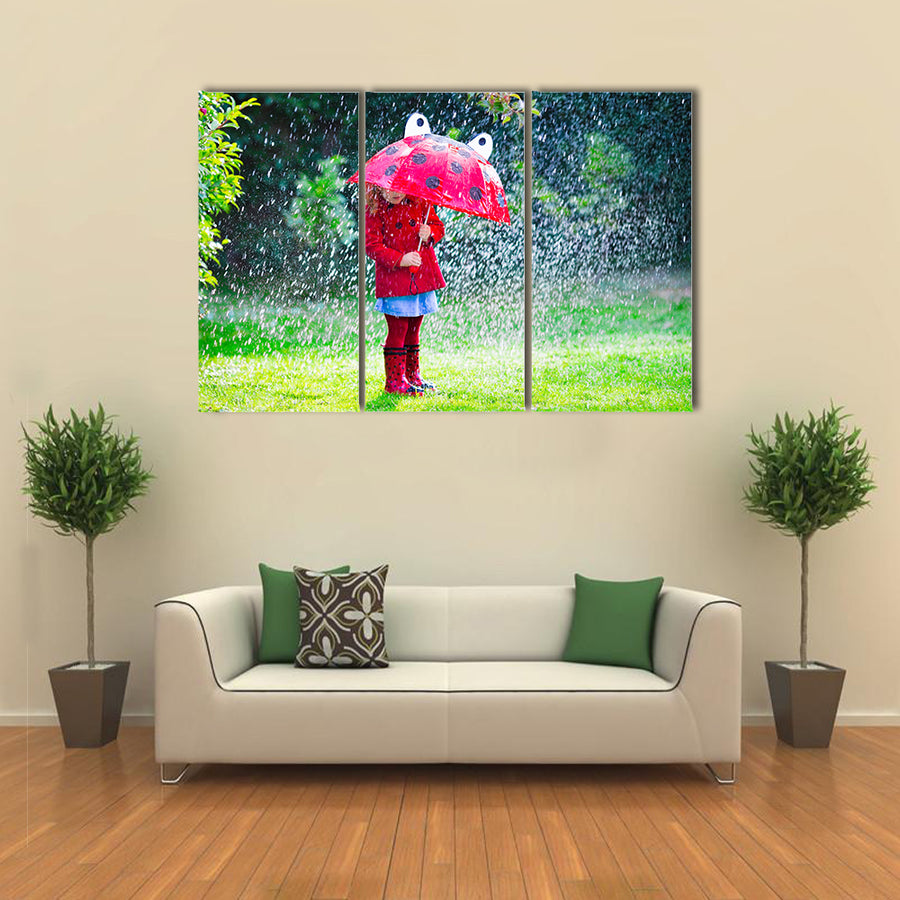 A Little Girl With Red Attire And Umbrella Enjoying The Serenity Of The Rain, Multi Panel Wall Art