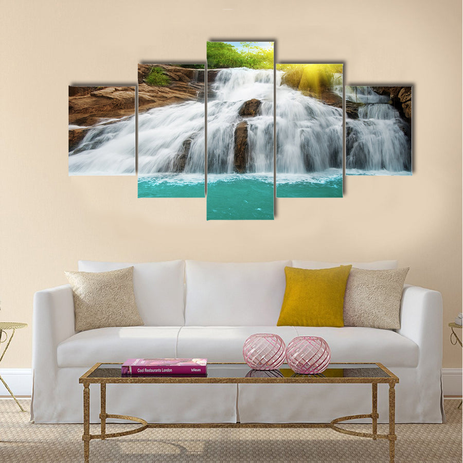 Waterfall pool in rain forest and sunlight Multi Panel Canvas Wall Art