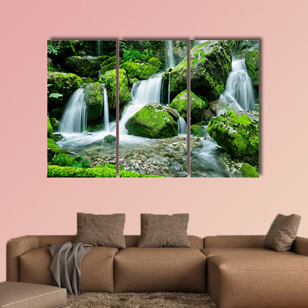 Beautiful waterfall with several cascades in the forest canvas wall art