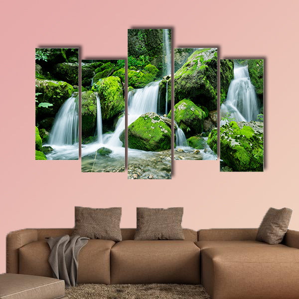 Beautiful waterfall with several cascades in the forest canvas wall art