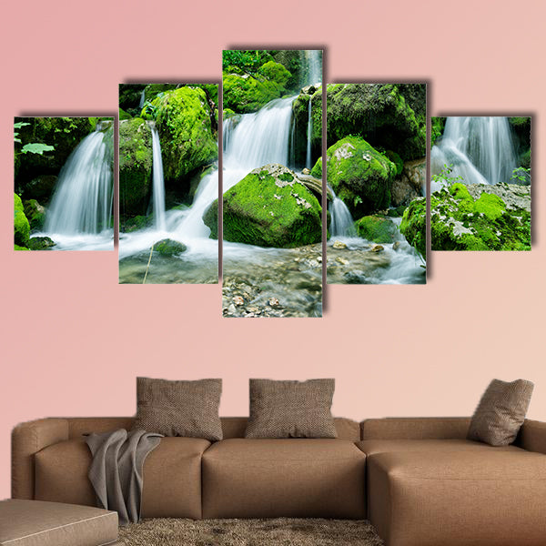 Beautiful waterfall with several cascades in the forest canvas wall art