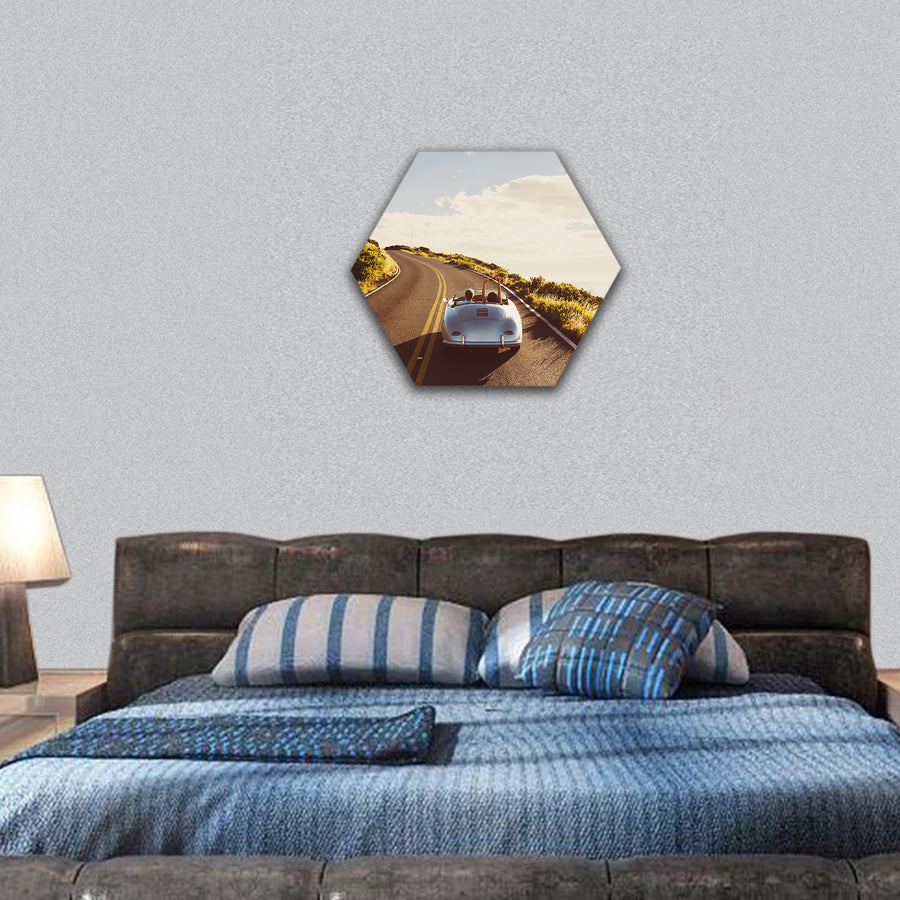 Couple Driving on Country Road in Vintage Sports Car hexagonal canvas wall art