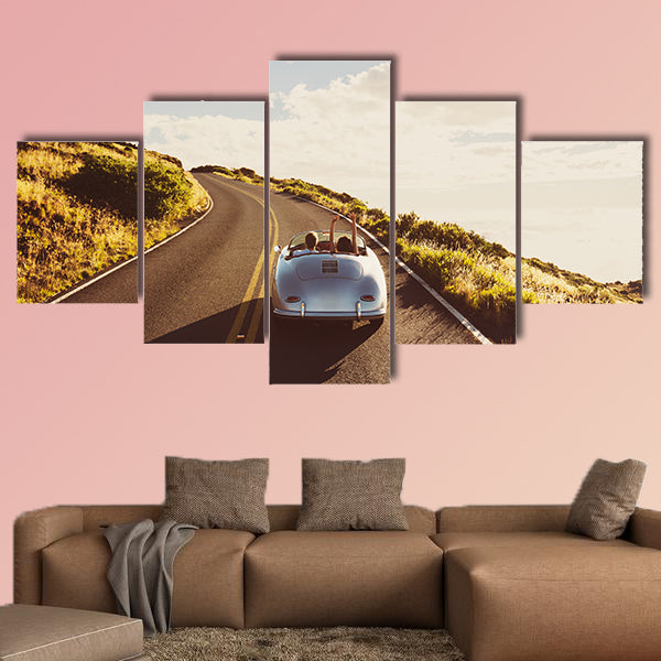 Happy Couple Driving on Country Road in Classic Vintage Sports Car wall art