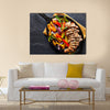 Mexican grilled chicken fajitas in iron skillet shot from overhead on slate Multi panel canvas wall art