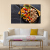 Mexican grilled chicken fajitas in iron skillet shot from overhead on slate Multi panel canvas wall art