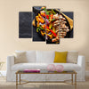 Mexican grilled chicken fajitas in iron skillet shot from overhead on slate Multi panel canvas wall art