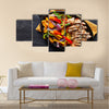 Mexican grilled chicken fajitas in iron skillet shot from overhead on slate Multi panel canvas wall art