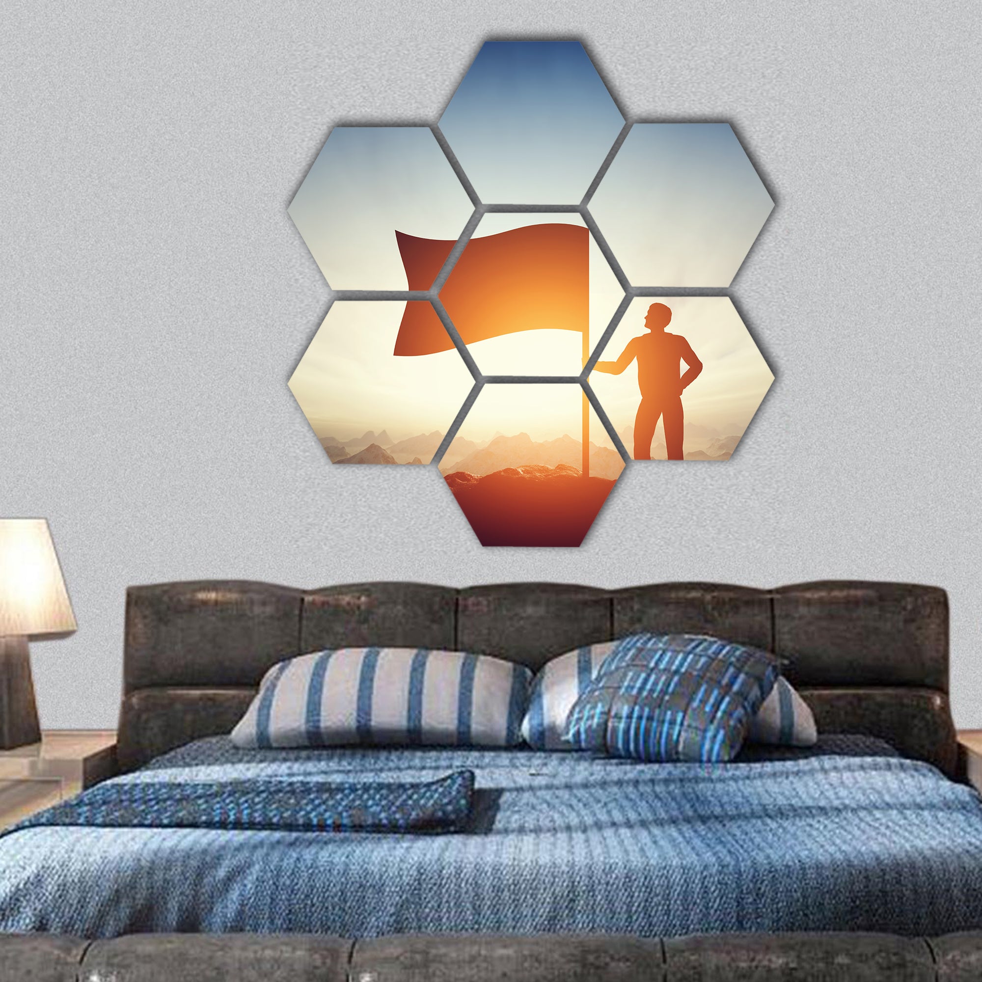 Man raising a flag on the peak of the mountain hexagonal canvas wall art