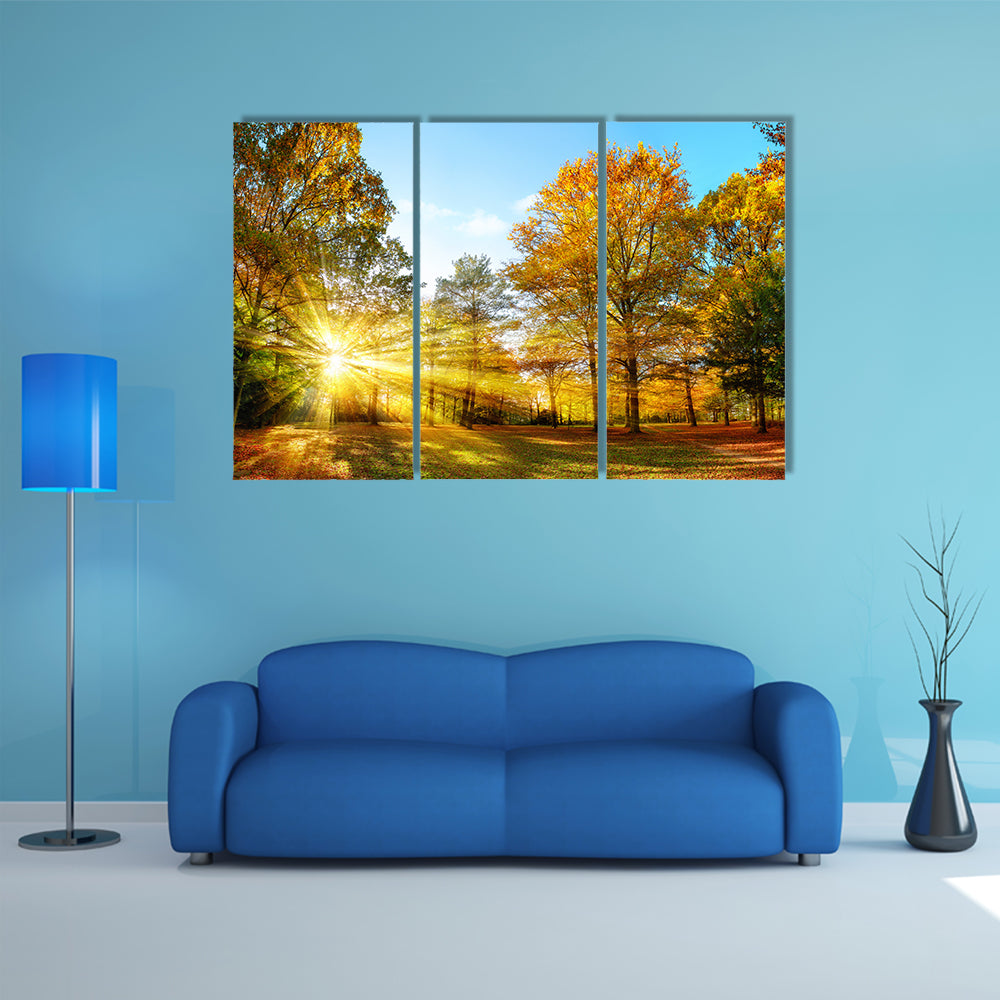Scenic autumn panorama with the sun shining through the gold multi panel canvas wall art