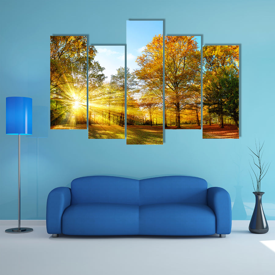 Scenic autumn panorama with the sun shining through the gold multi panel canvas wall art