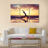 Silhouette of woman practicing yoga on the beach Multi panel canvas wall art