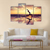 Silhouette of woman practicing yoga on the beach Multi panel canvas wall art