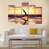 Silhouette of woman practicing yoga on the beach Multi panel canvas wall art