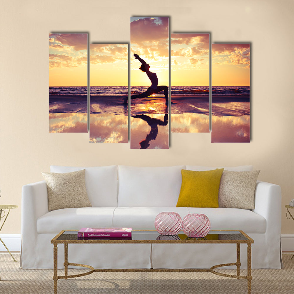Silhouette of woman practicing yoga on the beach Multi panel canvas wall art