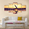 Silhouette of woman practicing yoga on the beach Multi panel canvas wall art