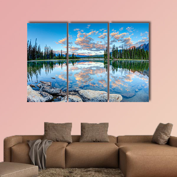 First glimpse of golden sunrise at Pyramid Lake in National Park, Canada wall art