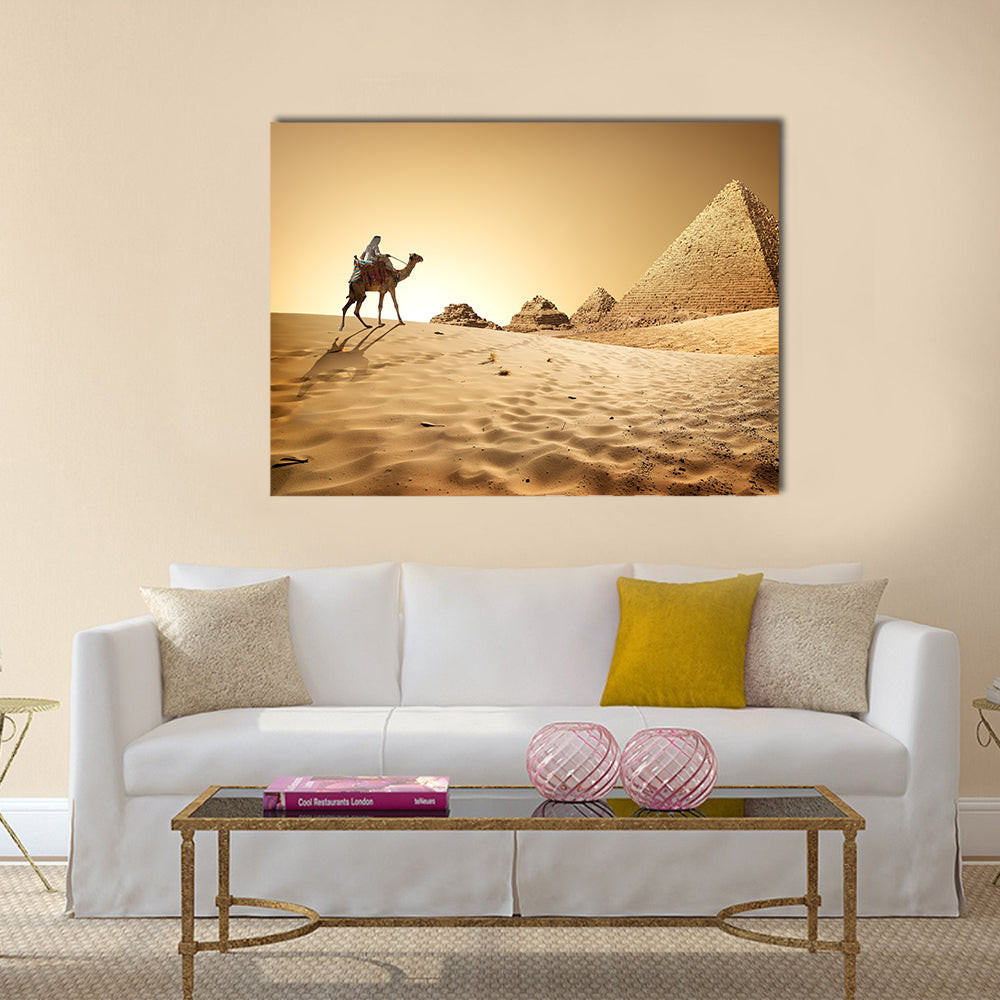 Bedouin on camel near pyramids in desert  Multi panel canvas wall art