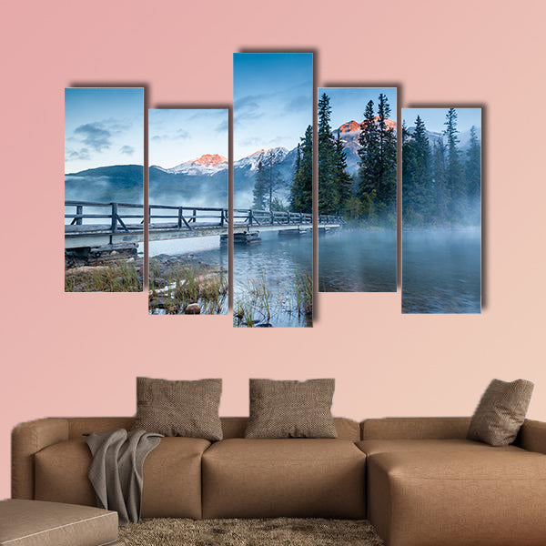 First glimpse of a golden sunrise on a misty and foggy morning multi panel canvas wall art