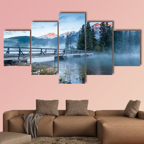First glimpse of a golden sunrise on a misty and foggy morning multi panel canvas wall art