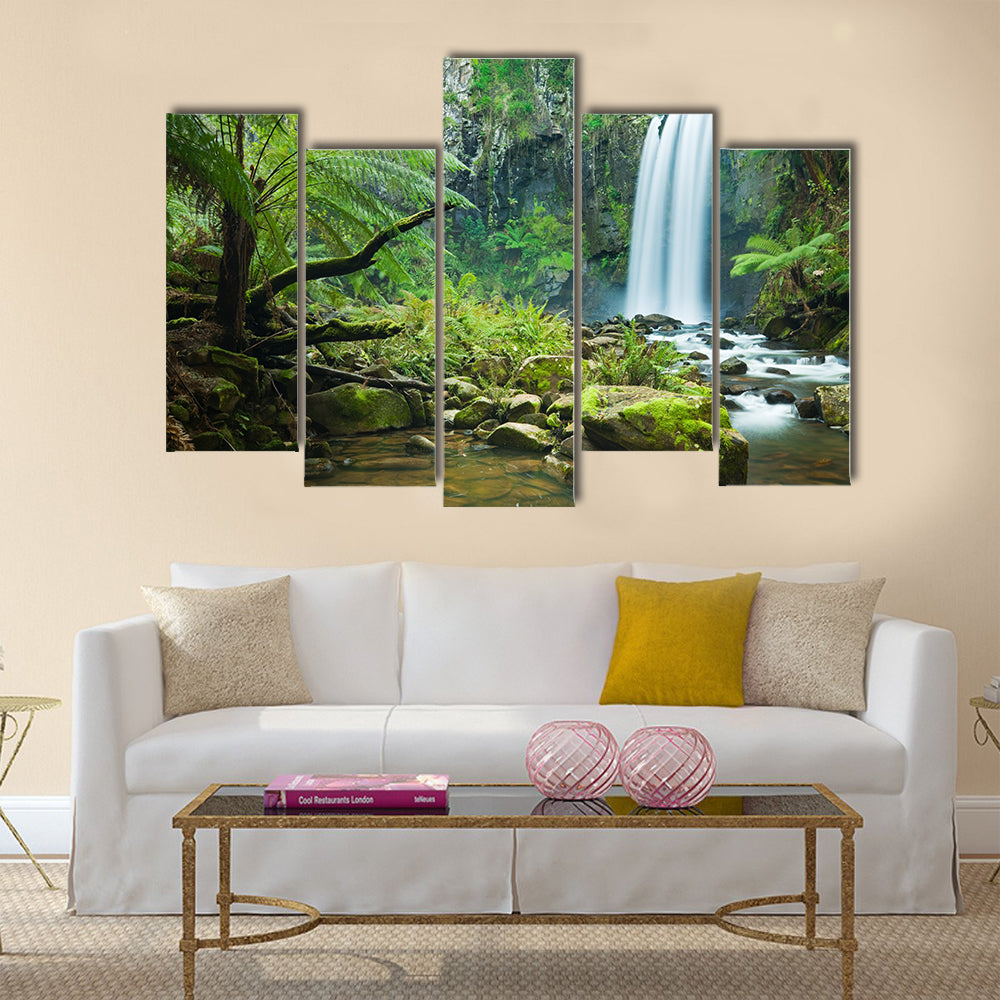 Waterfall in a lush rainforest Multi Panel Canvas Wall Art