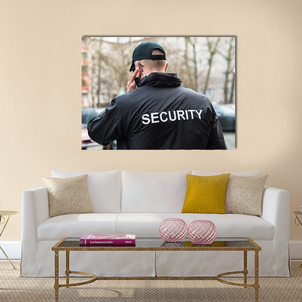 Security Guard In Black Uniform Multi panel canvas wall art