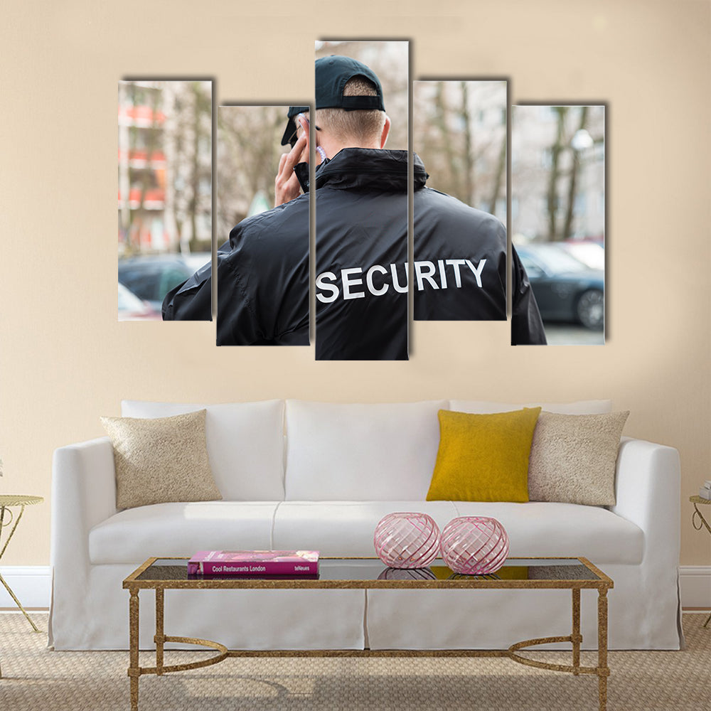 Security Guard In Black Uniform Multi panel canvas wall art