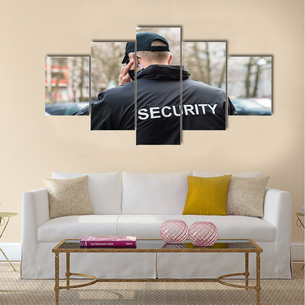 Security Guard In Black Uniform Multi panel canvas wall art